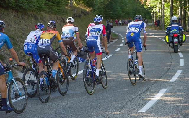 Road Cyclists racing up a hill