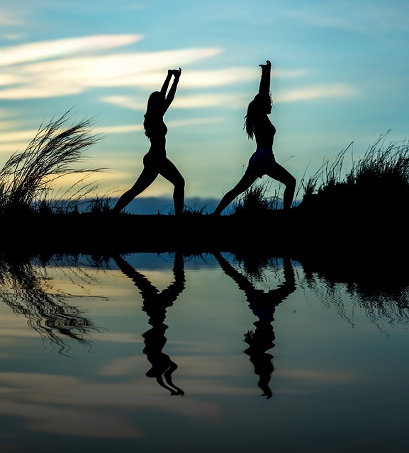 Women doing Yoga at Sunset